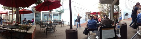 Gas heaters and red umbrellas make this outdoor space warm and welcoming.