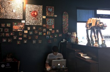 The coveted corner tables under the original art.